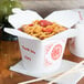 A white SmartServ microwavable paper take-out box with Chinese food inside.