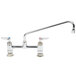 A T&S chrome deck-mount pantry faucet with two lever handles.