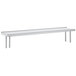 A stainless steel Advance Tabco table mounted shelf with a rear turn-up shelf.