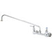 A T&S chrome wall mount faucet with a handle and 18" swing nozzle.