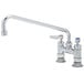 A T&S chrome deck-mounted faucet with lever handles and a swing nozzle.