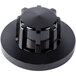 A close-up of a black plastic Garland oven temperature knob with a metal cap on top.