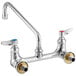 A chrome T&S wall mounted pantry faucet with two brass handles.