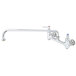 A T&S chrome wall mounted pantry faucet with a handle and swing nozzle.