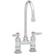 A chrome T&S deck-mount pantry faucet with two handles and two faucets.