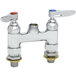 A chrome T&S deck mount faucet base with two silver T&S Eterna cartridges and chrome connections.
