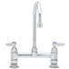 A T&S chrome deck-mounted faucet with two handles and two faucets.
