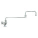 A chrome T&S wall mount faucet with a long double joint nozzle and 4 arm handle.