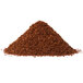 A pile of brown granules on a white background.