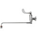 A chrome T&S wall mounted wok wand range faucet with a wrist handle and hose.