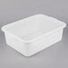 A Tablecraft white plastic freezer safe drain box combo with a handle.