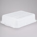 A white plastic Tablecraft freezer safe drain box combo with vertical lines.
