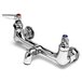 A T&S rough chrome wall mount service sink faucet with two handles and red indexes.