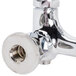 A close-up of a T&S chrome plated wall mount mop sink faucet with a nut on the end.