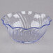 A clear plastic bowl with a blue swirl pattern on the rim.