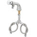 A chrome T&S metering faucet with flex inlets.