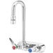 A T&S chrome wall mount faucet with 2 red and blue lever handles.