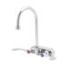 A T&S chrome wall mount faucet with blue and red wrist action handles.