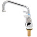 A chrome T&S deck-mount workboard faucet with a metal spout and tailpieces.