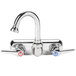 A chrome T&S wall mount workboard faucet with a gooseneck spout and two handles.