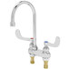 A chrome T&S deck mount medical faucet with two wrist action handles.