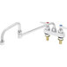 A chrome T&S deck-mount faucet with double joint nozzle and two levers.
