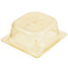 A Vollrath Super Pan 1/6 size amber plastic food pan with a lid.