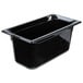 A black Vollrath plastic food pan on a counter.