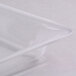 A clear plastic Cal-Mil bakery tray with a pointed edge.