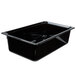 A Vollrath black plastic food pan on a counter.