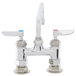 A T&S chrome deck-mount sink faucet with two handles and a swing nozzle.
