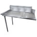 A stainless steel Advance Tabco clean dishtable with legs.