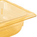 A yellow Vollrath Super Pan plastic food pan on a counter.