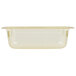 A Vollrath 1/3 size amber plastic food pan with a clear lid.