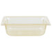 A clear plastic Vollrath food pan with amber tint.
