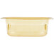A Vollrath 1/9 size amber high heat plastic food pan with a lid.