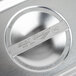 A close up of a Vollrath stainless steel slotted cover on a metal object.