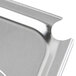A close up of a Vollrath stainless steel slotted pan cover.