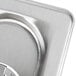 A close up of a stainless steel Vollrath long pan cover.