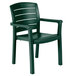 A pack of 4 green Grosfillex Acadia stacking resin armchairs.