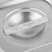 A close-up of a Vollrath stainless steel pan with a solid lid.