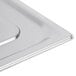 A Vollrath stainless steel slotted lid on a metal tray.