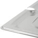A Vollrath stainless steel slotted cover on a metal tray.