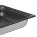 A Vollrath stainless steel steam table pan with SteelCoat Non-Stick coating on a counter.