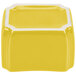 A yellow ceramic cube with white trim.