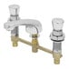 A T&S chrome metering faucet with two brass valves and push button caps.