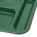 A Carlisle forest green melamine tray with six compartments.