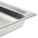 A Vollrath stainless steel steam table pan with a drain.