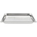 A Vollrath stainless steel steam table pan with perforated metal on a white surface.