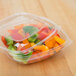 A clear Sabert plastic bowl filled with vegetables.